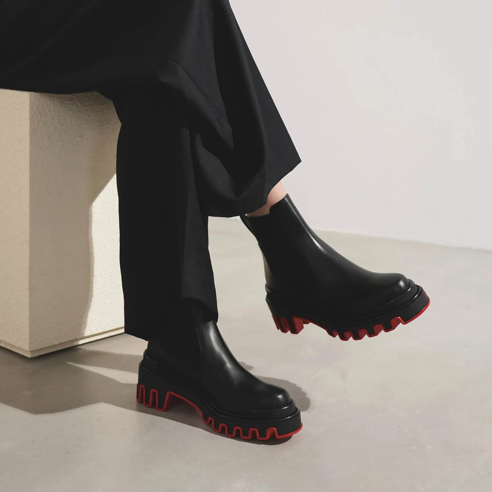 Marchacroche black leather ankle boots